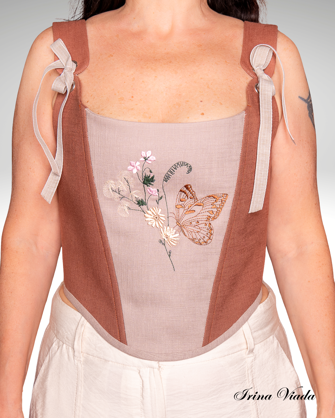 Corsetto in lino con ricamo floreale